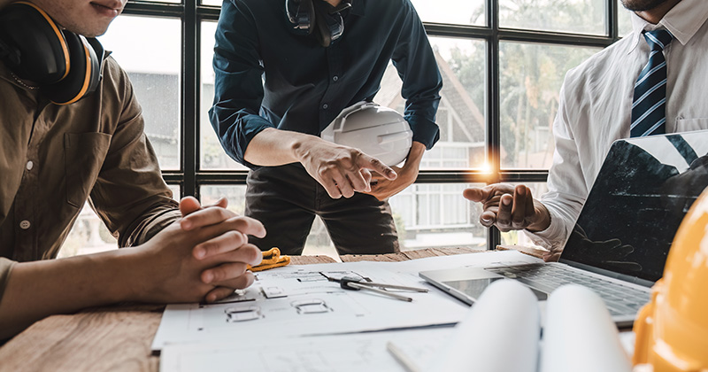 Plumbers Looking Over Plans